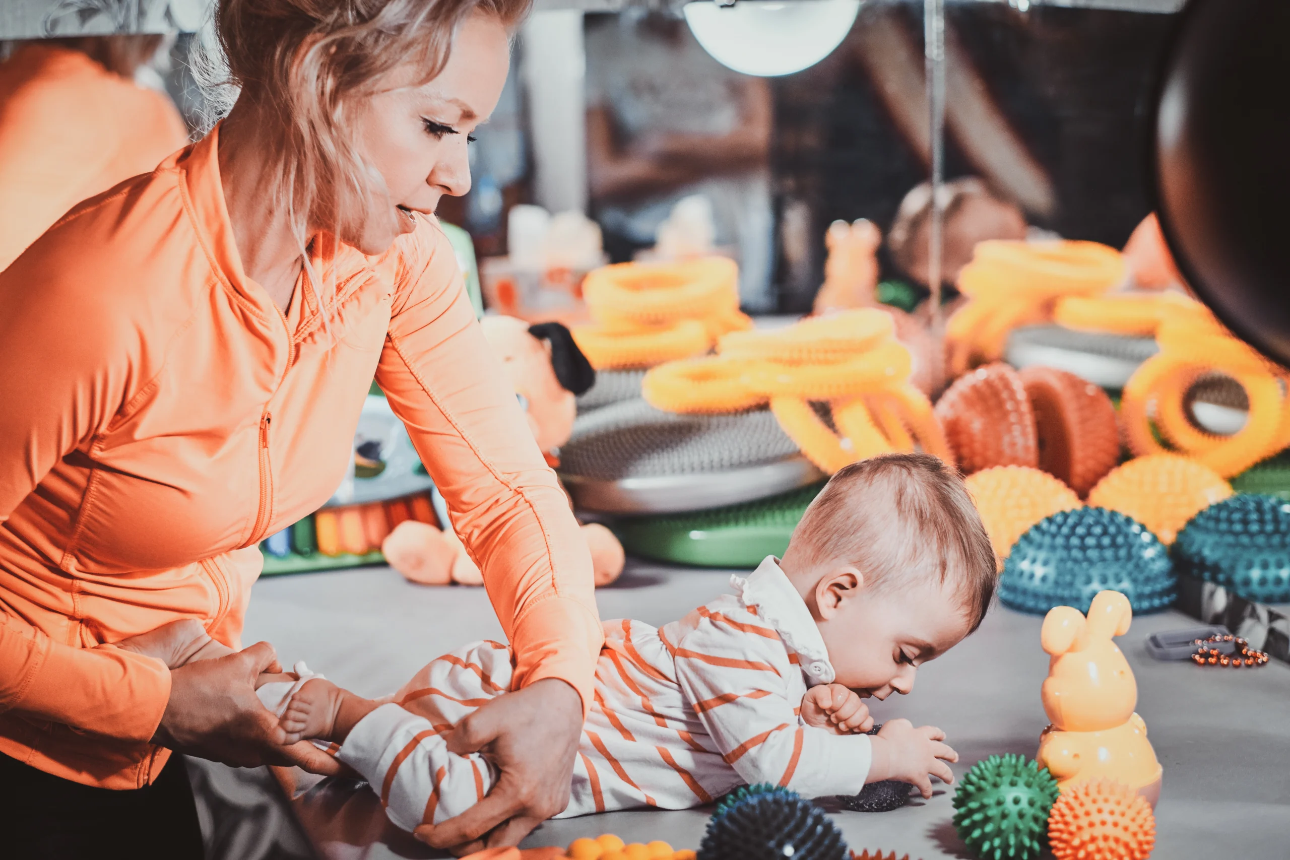 Pediatric therapy session — therapist playing and working with child patient