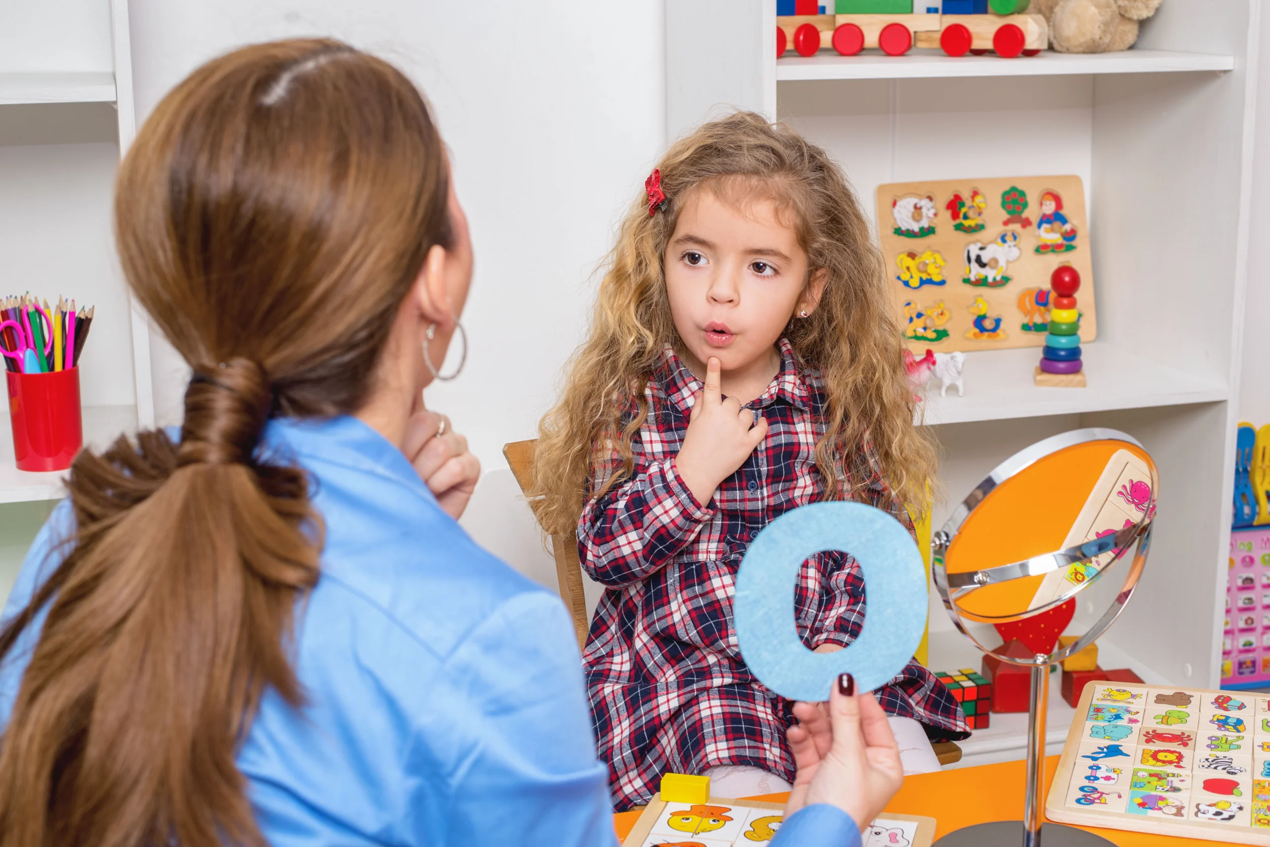 Speech language therapy session — therapist working with patient on communication